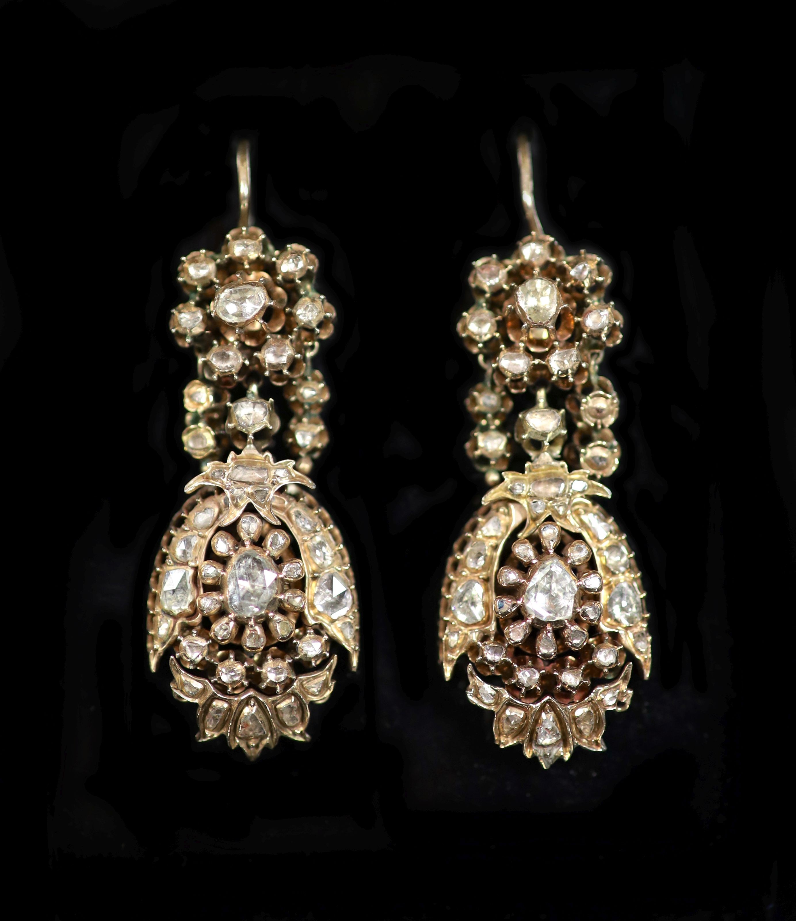 A pair of antique gold and rose cut diamond cluster set drop earrings